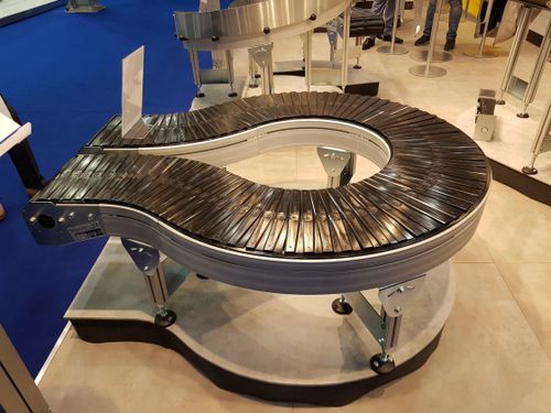 Ленточный конвейер - AmbaVeyor - AmbaFlex Spiral Conveyor Solutions - роликовый / горизонтальный / изогнутый