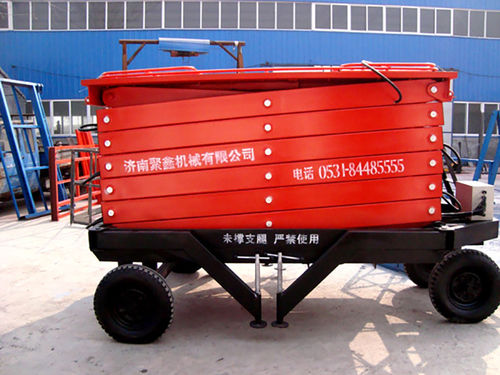 Колесный ножничный подъемник - a11001 - Jinan Juxin Machinery Co., Ltd. - для внутреннего и внешнего пользования / вездеход / для использования в промышленности