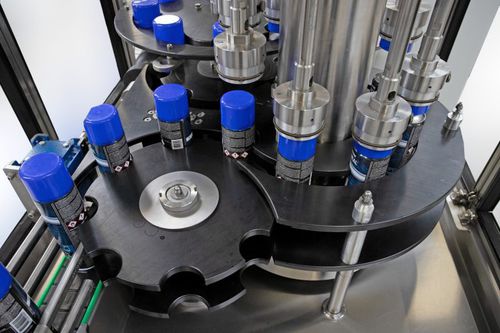 Ротационное устройство закупорки бутылок - R and R Aerosol Systems - полностью автоматическое / для шпуль / для химической промышленности