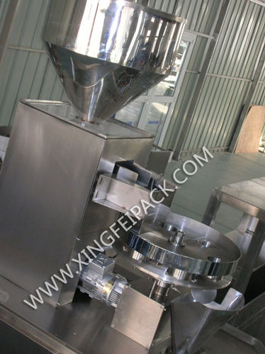 Дозатор для гранул - Shanghai Xingfei Packaging Machinery Co., Ltd. - объемный / автоматический / с поворотным столом