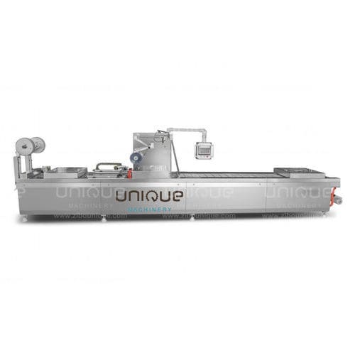 Автоматическая упаковочная машина - Zibo Unique Machinery Co., Ltd. - вакуумная / c пленкой / для продуктов питания