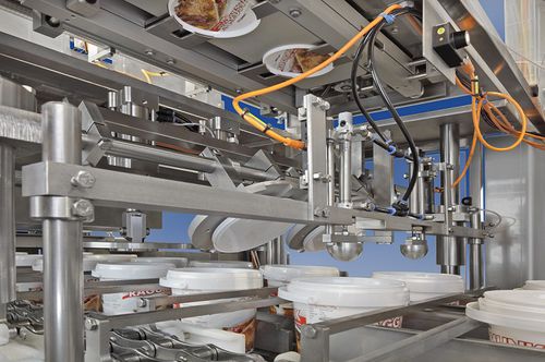 Автоматическая машина для насадки крышек - Robot Food Technologies Germany GmbH